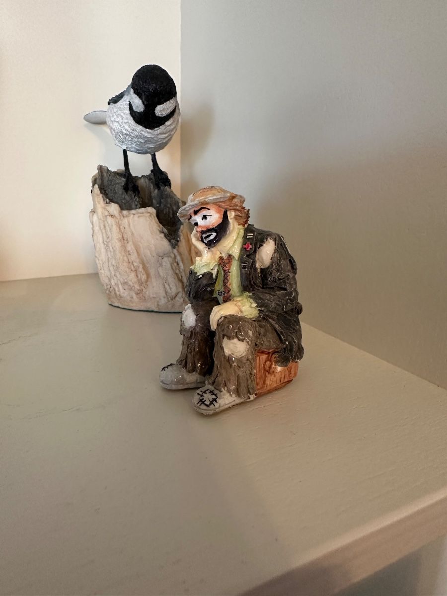 Figurine Grouping: Bird and Homeless Man