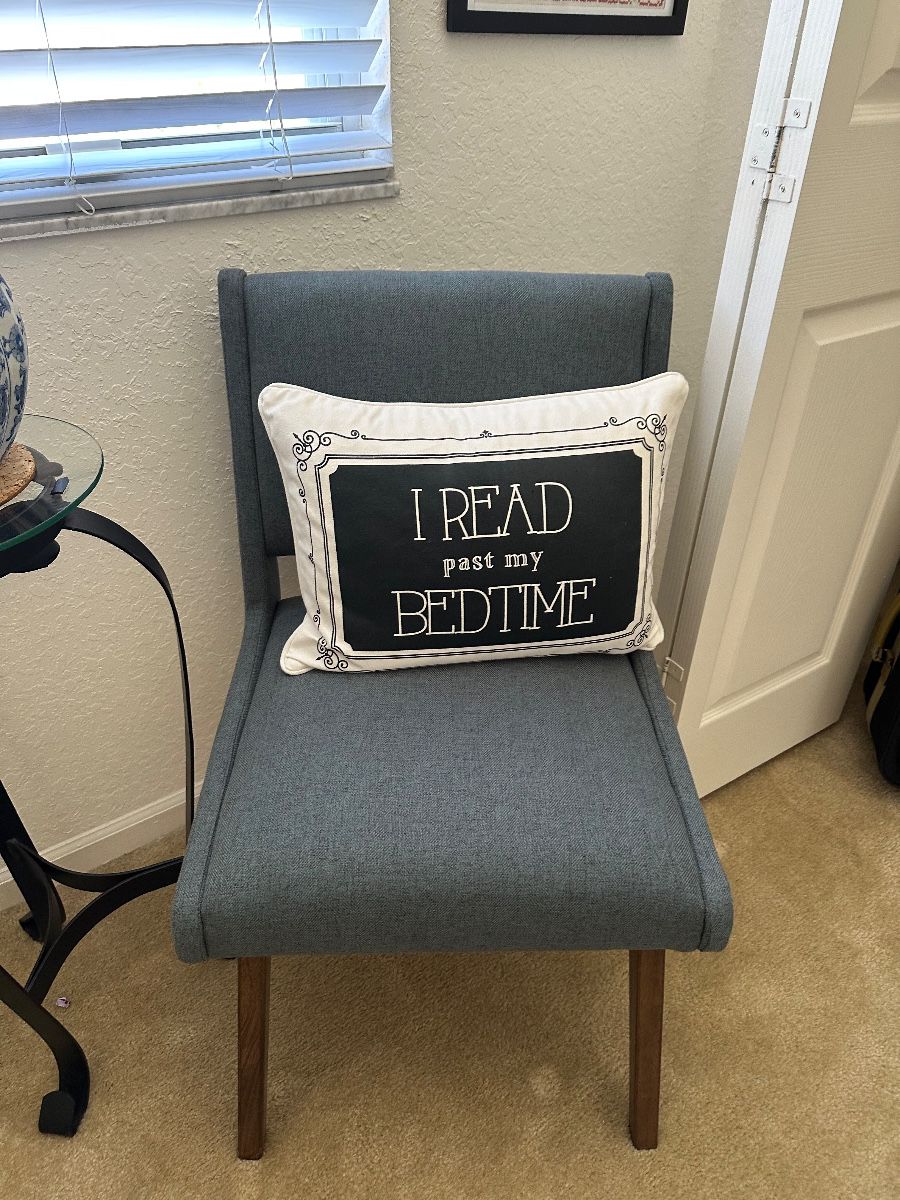Modern Gray Upholstered Accent Chair with 'I Read Past My Bedtime' Pillow