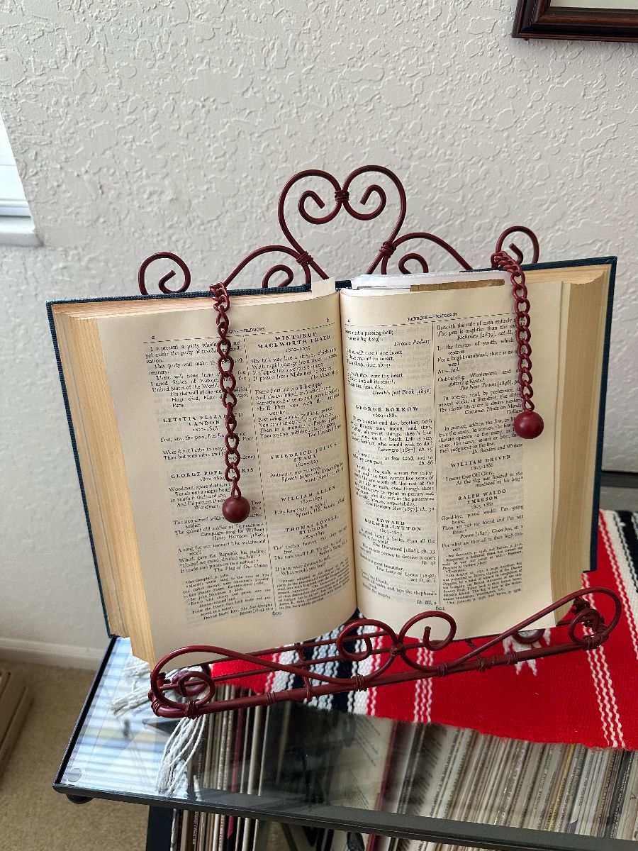 Antique Hardbound Book Collection with Ornate Metal Book Stand