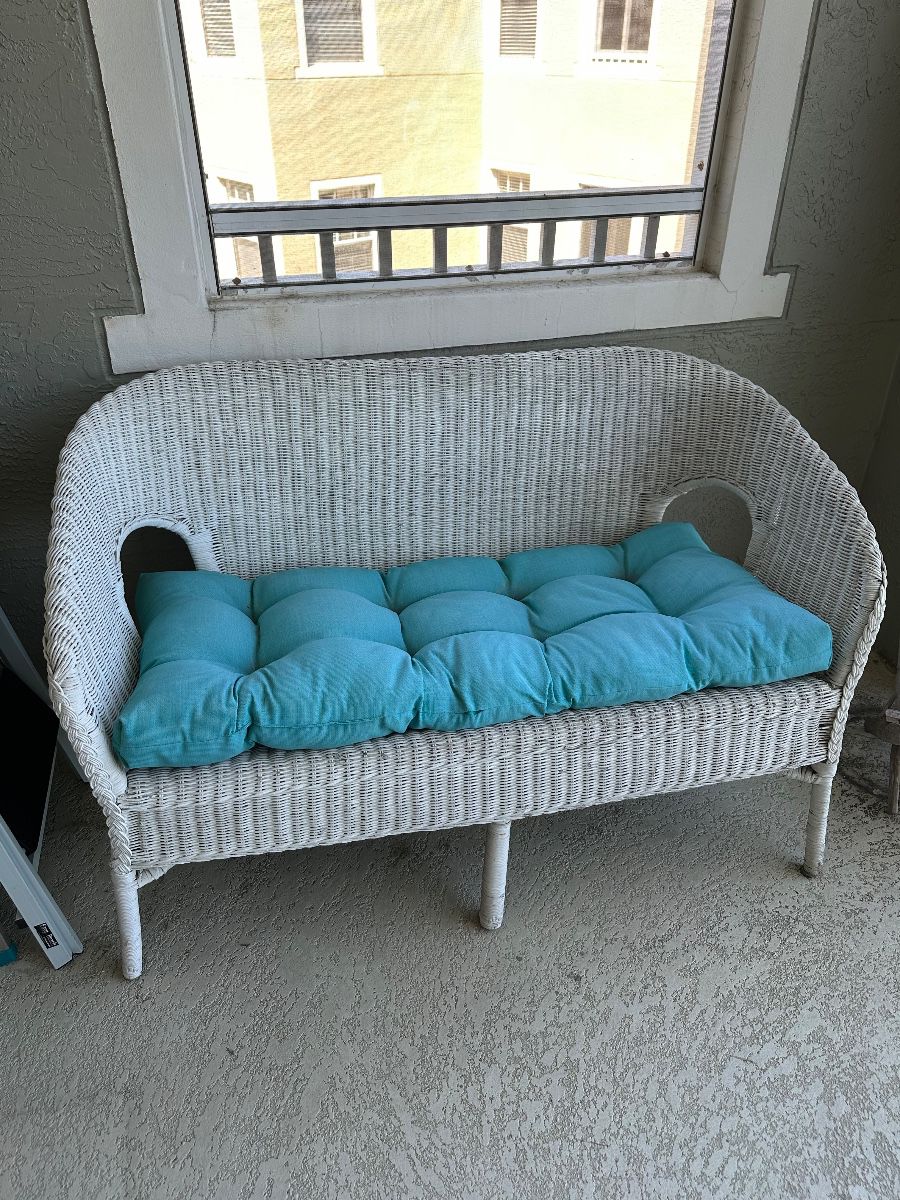 Wicker Loveseat with Teal Cushion