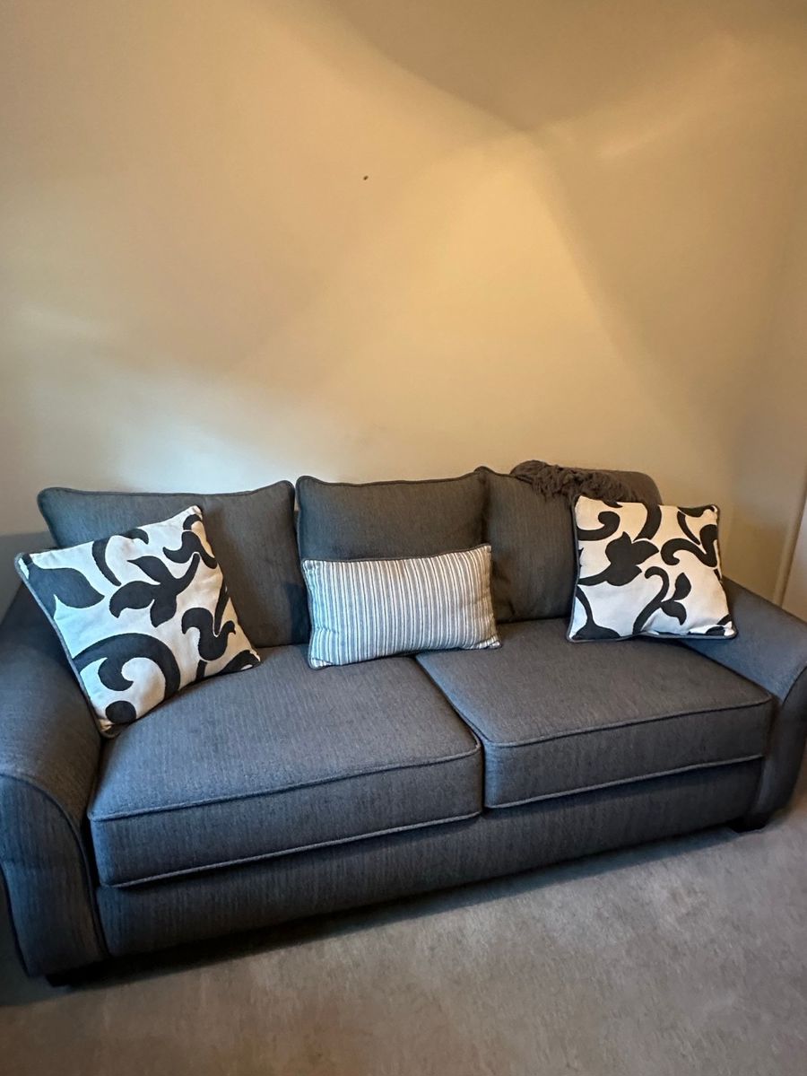 Charcoal Gray Upholstered Sofa with Decorative Pillows