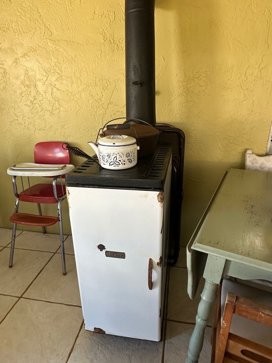 Vintage Stove with Kitchenware Assortment