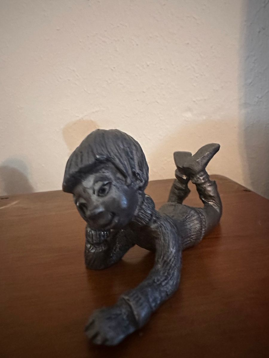 Pewter Figurine of Reclining Boy