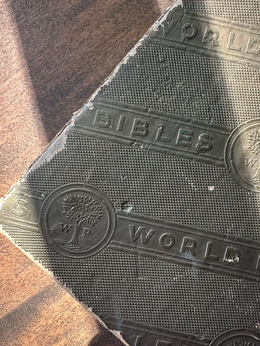 Antique Bible Cover with Embossed Text and Emblem