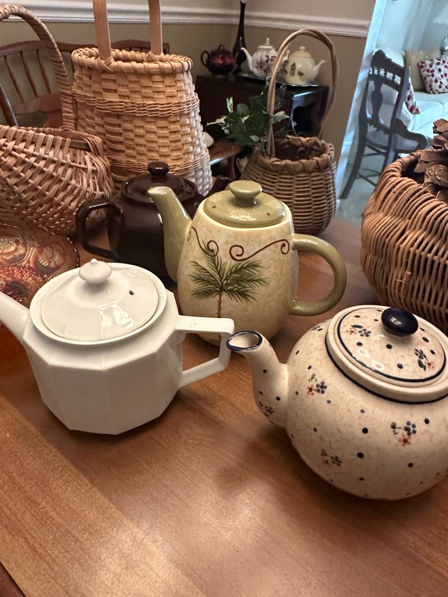 Assortment of Vintage Teapots and Woven Baskets