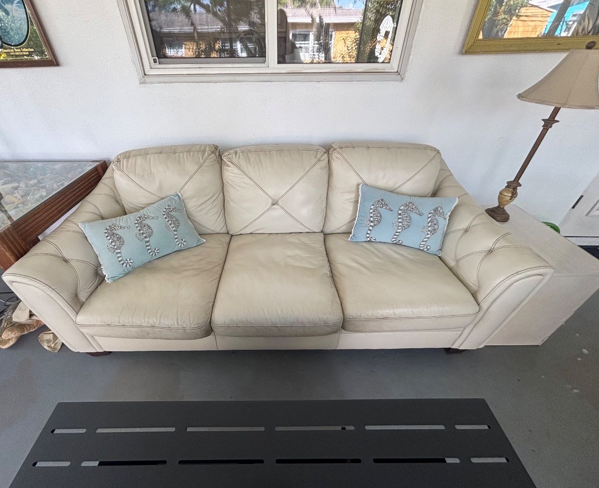 Cream Leather Three-Seater Sofa with Seahorse Throw Pillows