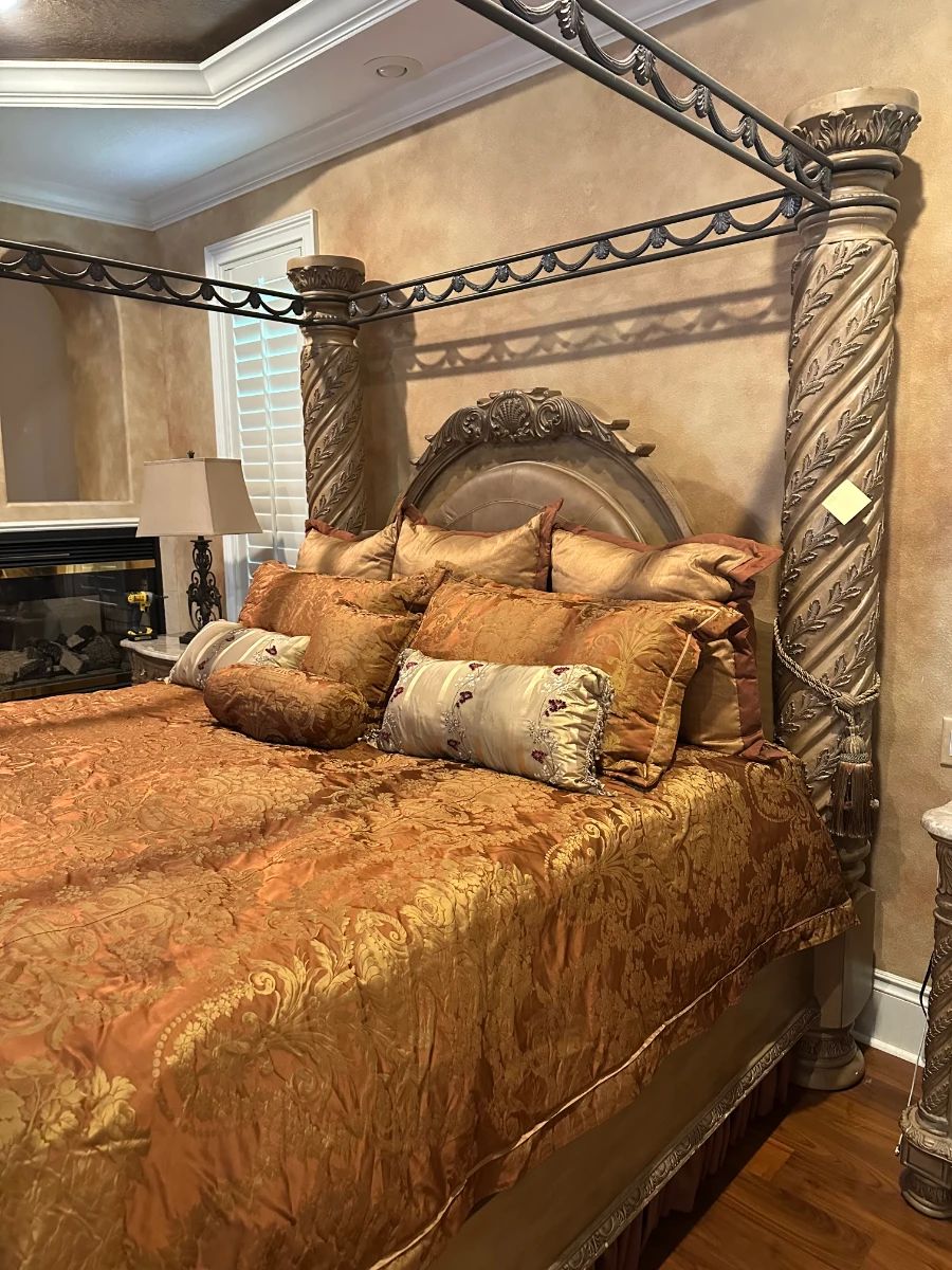 Luxury Four Poster Bed with Ornate Carved Posts and Damask Bedding