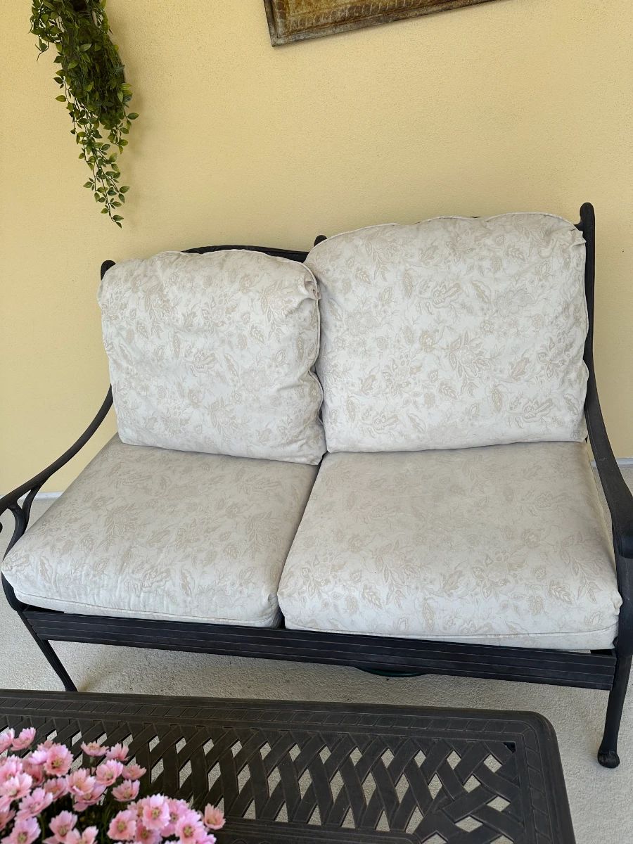 Wrought Iron Outdoor Loveseat with Floral Cushions