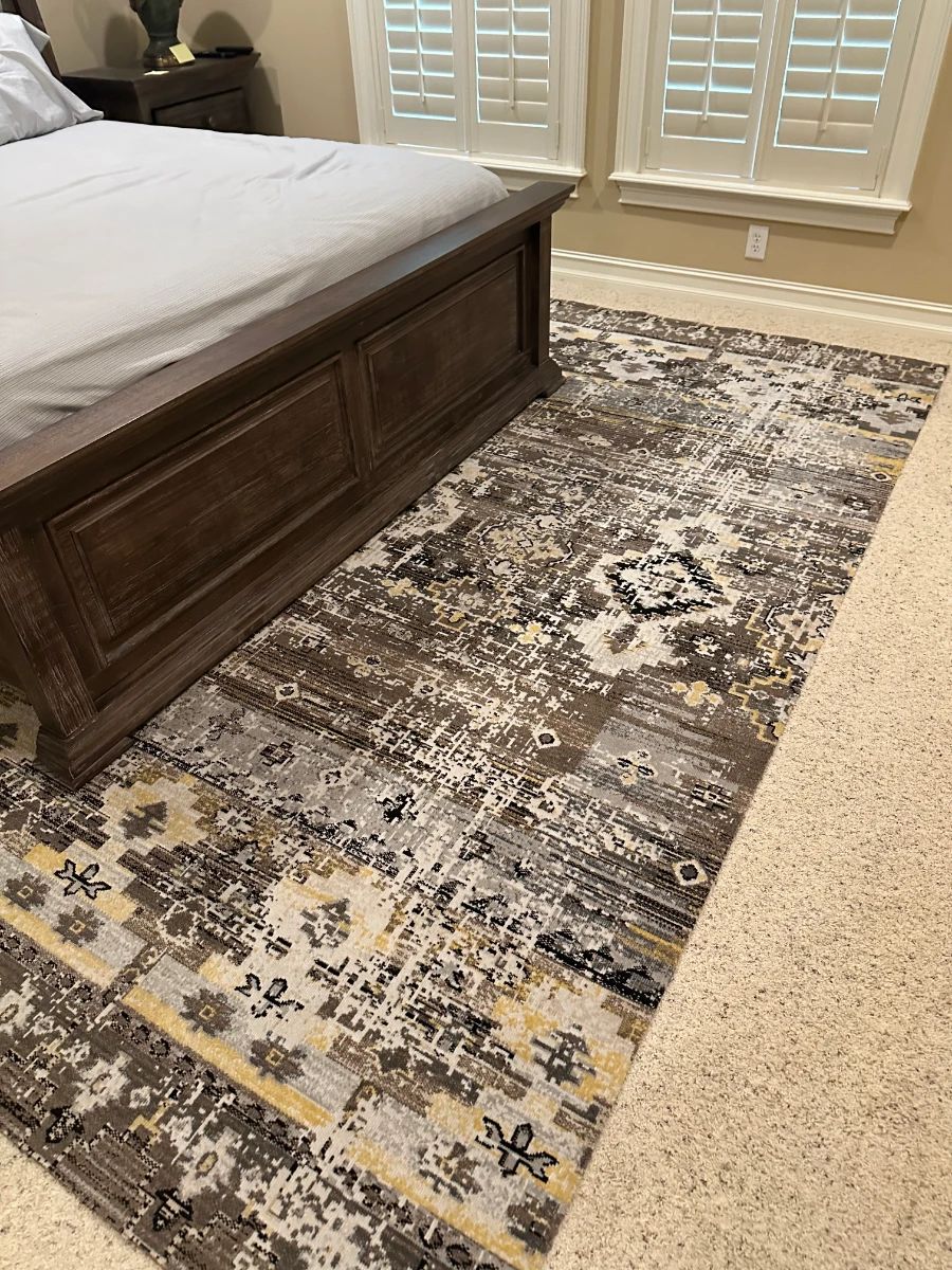 Dark Wood Paneled Bed Frame & Distressed Abstract Area Rug