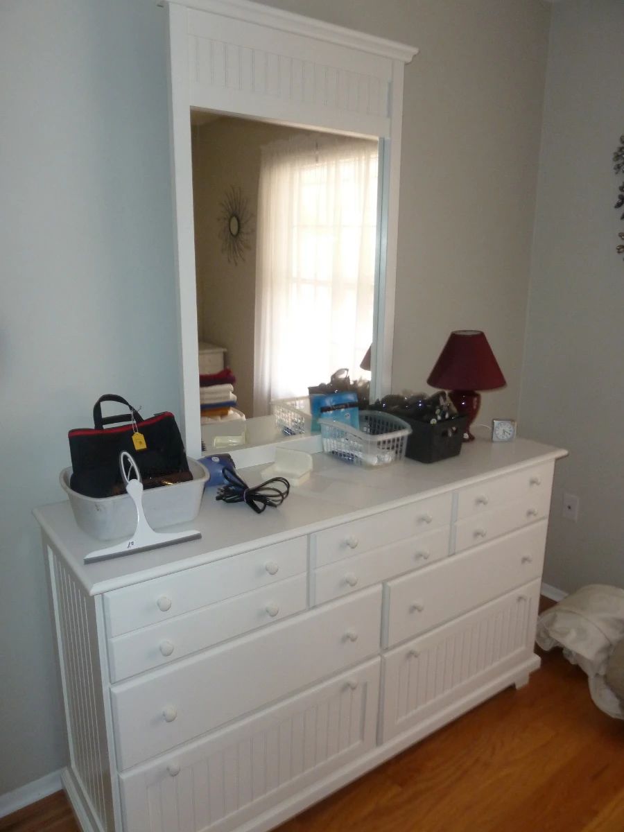 White Dresser with Mirror and Assortment of Home Goods