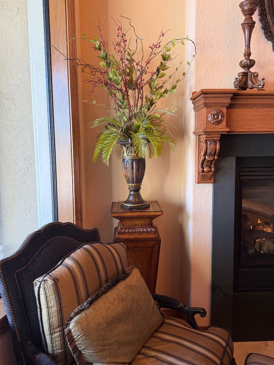 Decorative Floral Arrangement with Pedestal and Armchair Grouping