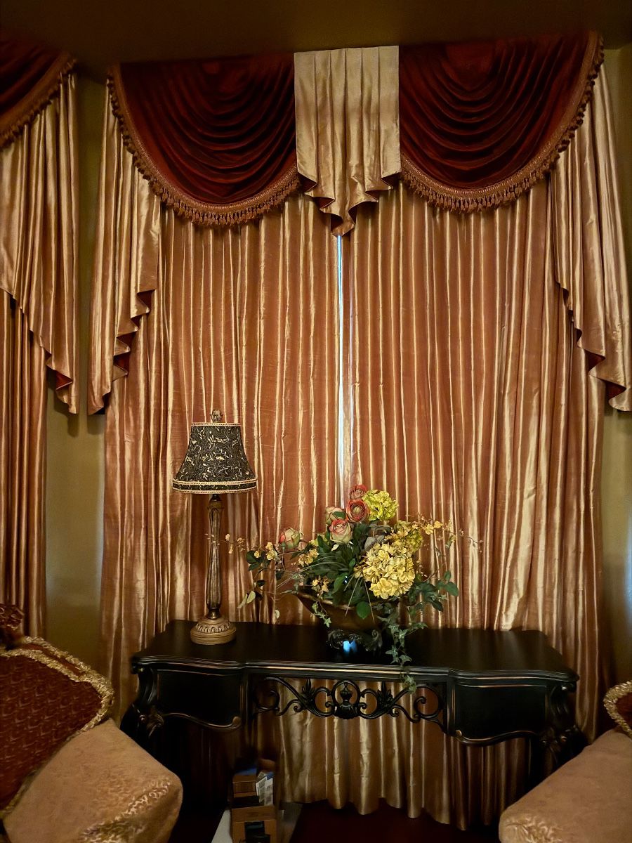 Decorative Console Table Grouping with Lamp and Floral Arrangement