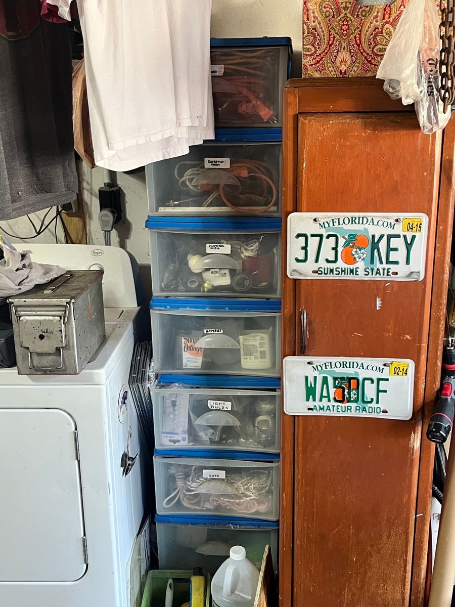 Garage Storage Assortment: Electrical, Lighting, and Collectible License Plates
