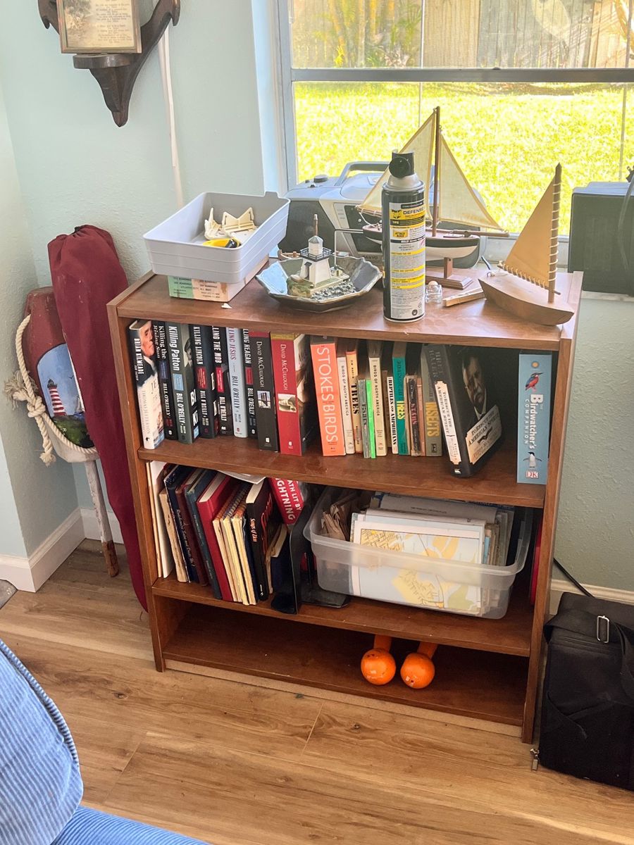Bookshelf with Nautical Decor and Assorted Books