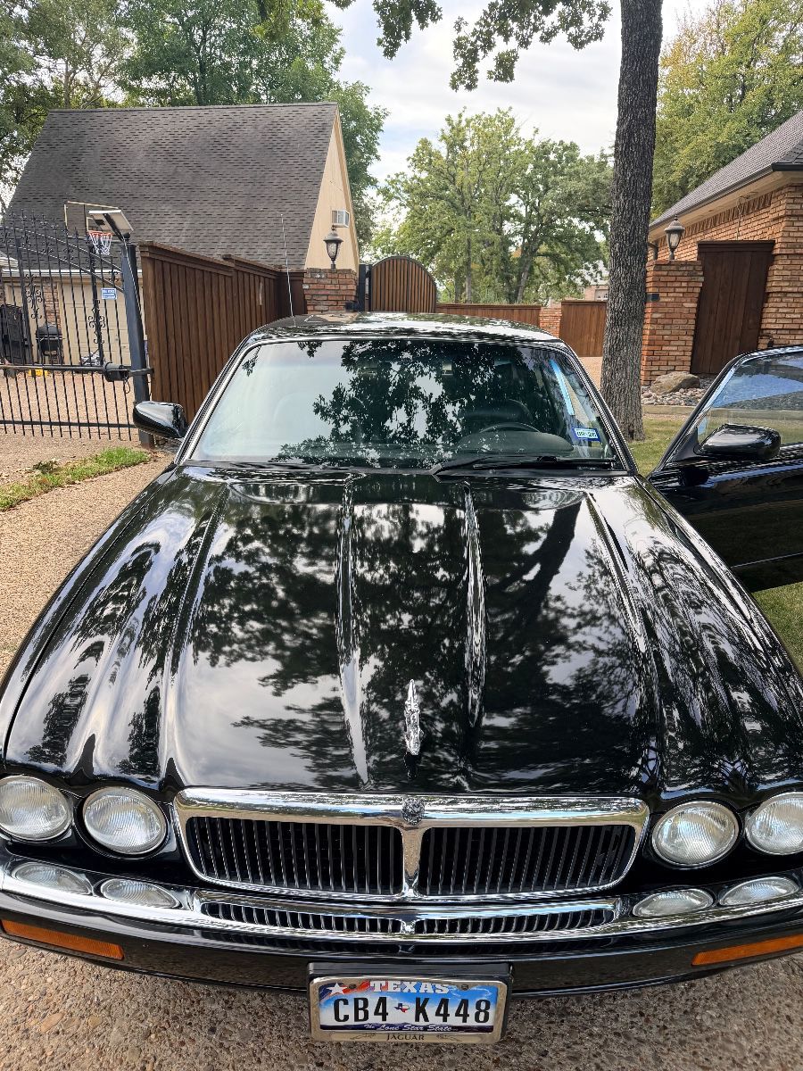 Items on offer in Bedford, TX — Vintage Jaguar, Snoopy collectibles, Lots of books, Art, Furniture, More!